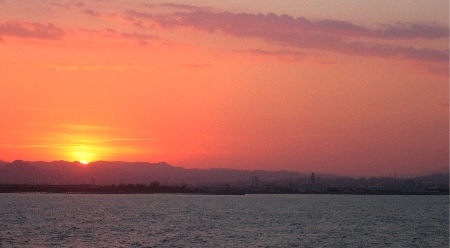 Sunset over barcelona, from the ferry